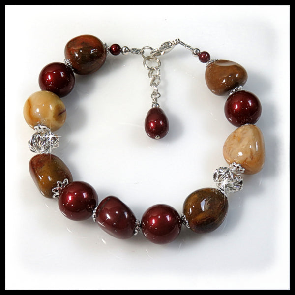 Handmade Mookaite gemstone bracelet with burgundy and mustard stones, sterling silver beads, clasp, and extender chain. Natural earth-tone artisan jewelry.