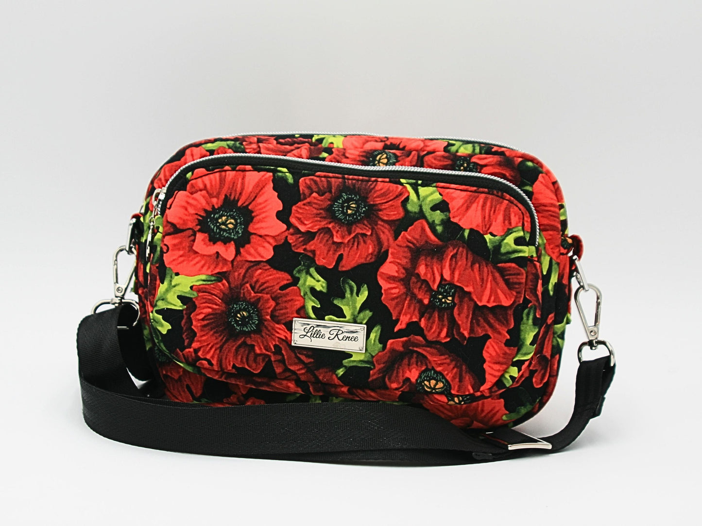 Front View of the Crossbody
A stylish and functional poppy-print crossbody bag with two zippered sections, perfect for keeping essentials organized on the go.