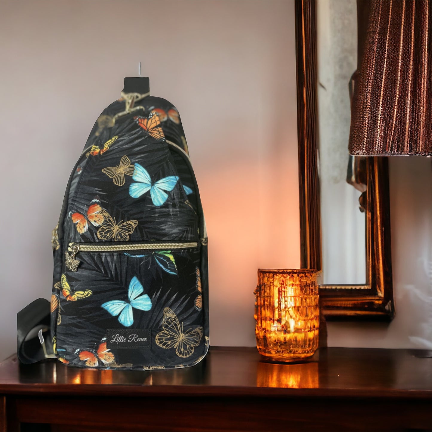 "Butterfly Sling Bag with blue and orange and Metallic Gold Butterflies – Features a Front Zipper Pocket, with Butterfly Zipper Pulls."