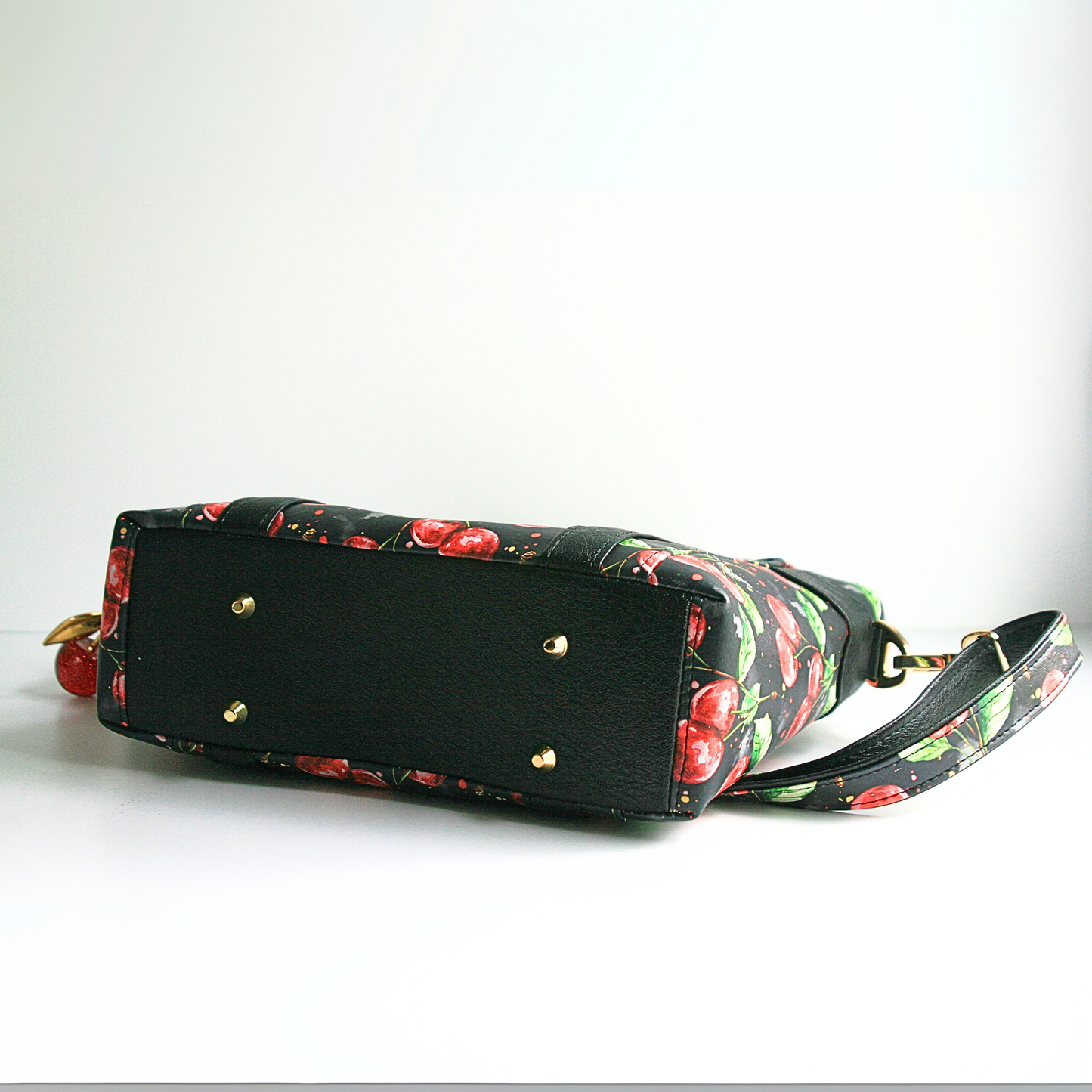 The Cherries Jubilee exclusive vinyl tote bag with gold purse feet