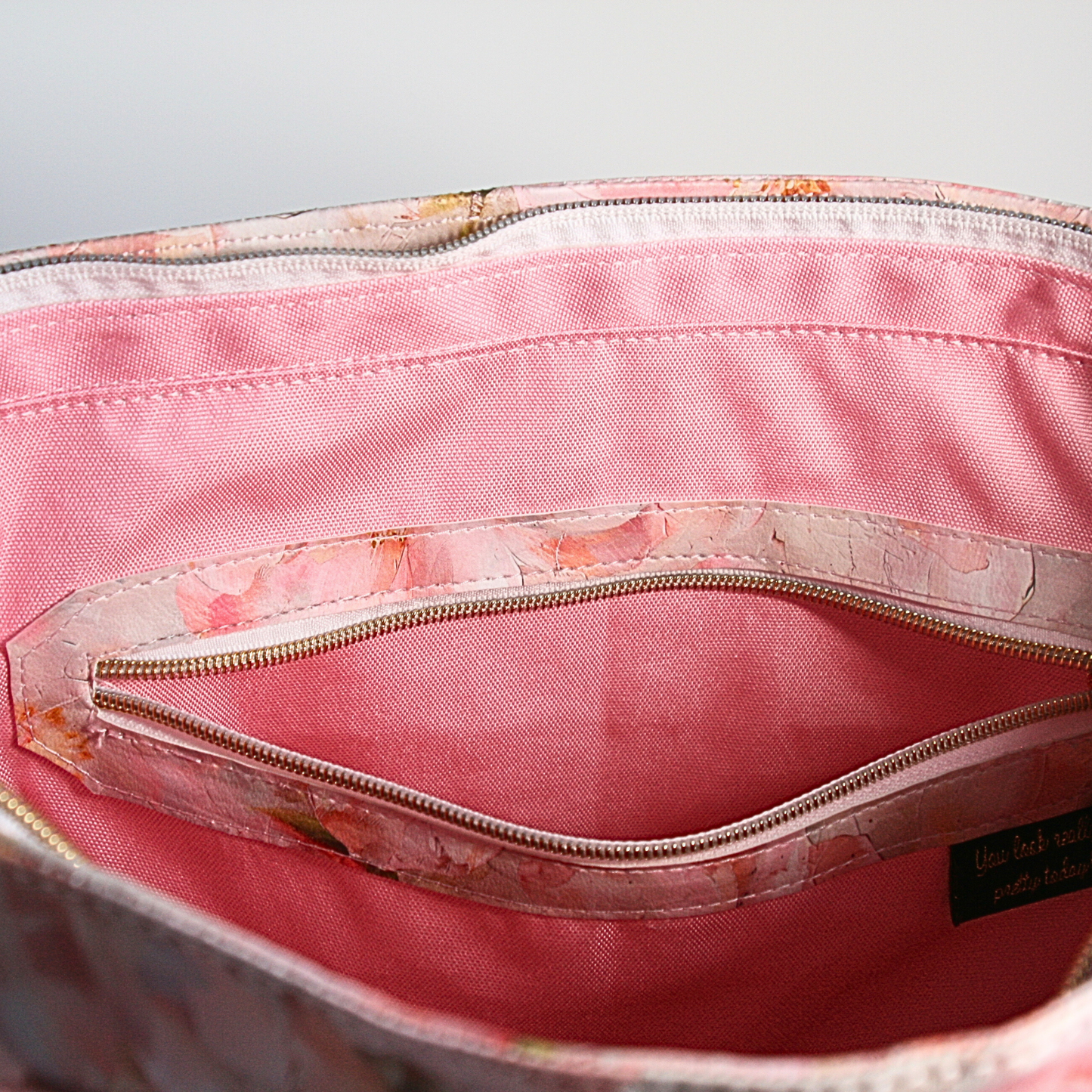 Interior zipper pocket in the Passionate Pink Floral Tote Bag