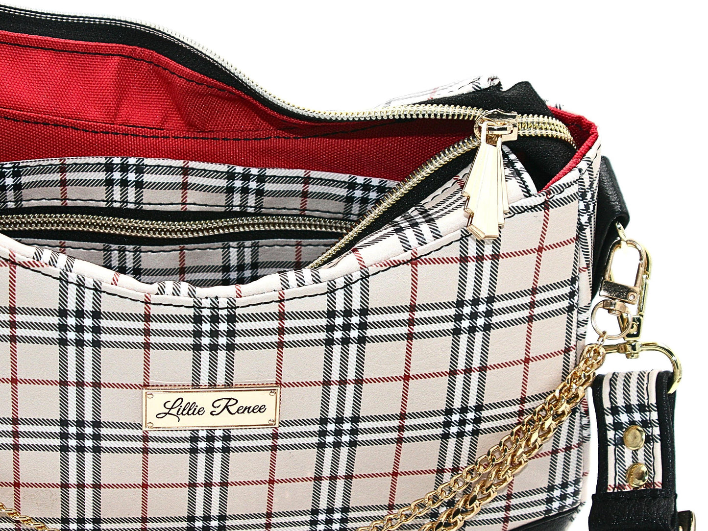 The closure zipper and the interior zipper pocket features the Gatsby zipper pull in unique gold hardware