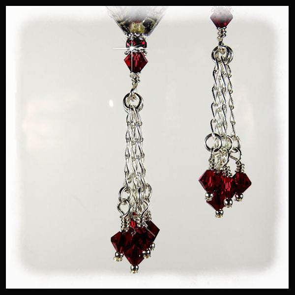 The red siam swarovski crystals hand from 1" sterling silver chains