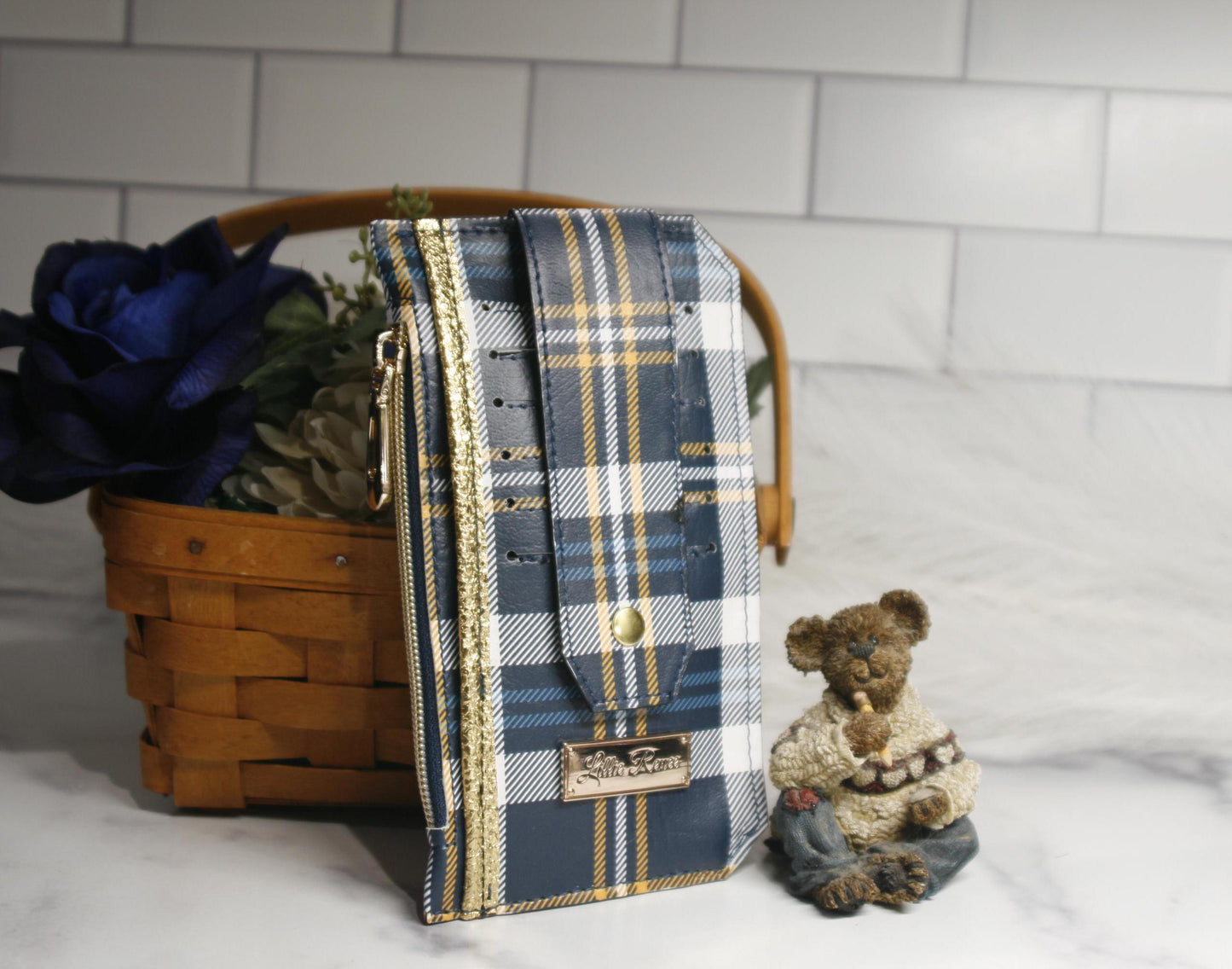 Blue and yellow tartan plaid Purse Pal slim wallet featuring six card slots secured with a snapped strap, a cash slip pocket, and a zippered coin pocket. Accented with gold hardware, this stylish and compact wallet is perfect for everyday use, travel, and gift-giving.