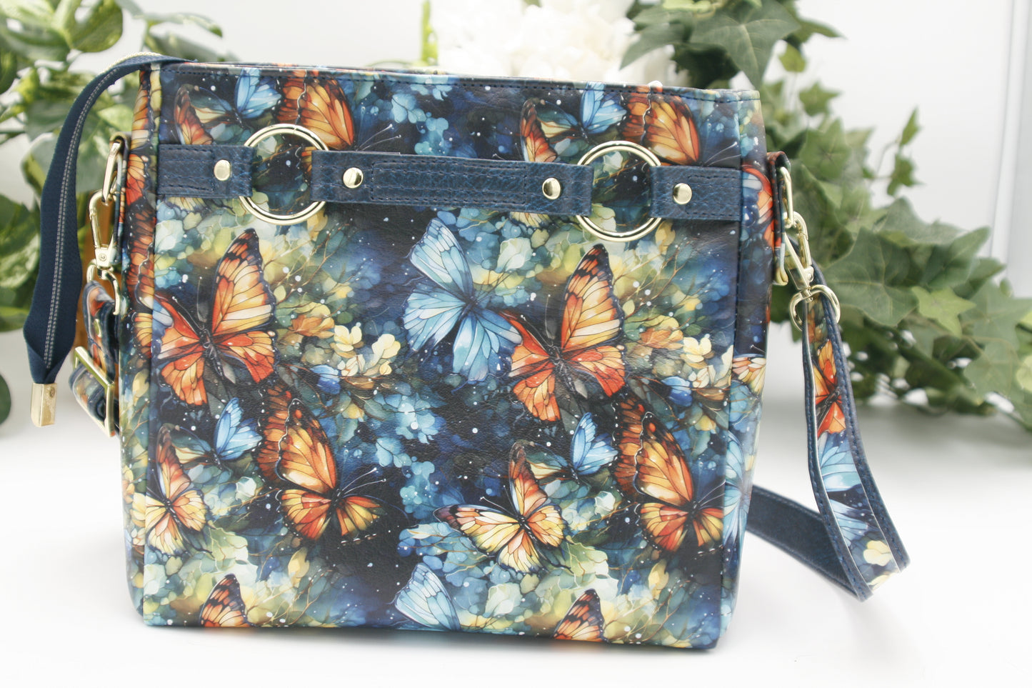 the back of the Watercolor Butterfly Momexa features a Vibrant watercolor butterfly print – A dreamy mix of blues and orange with gold accents on a durable, high-quality vinyl
