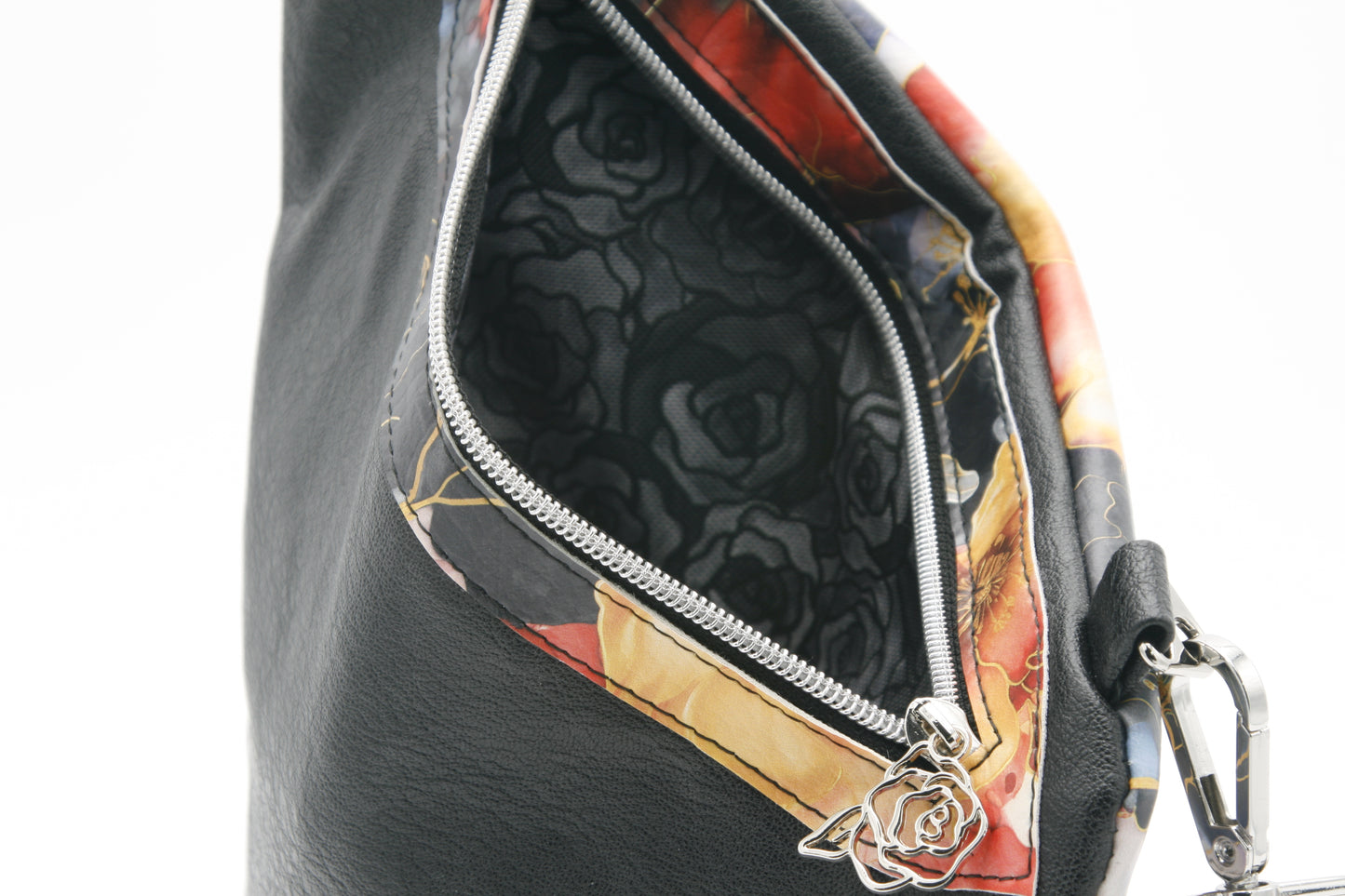 Spacious interior pocket – Lined with black rose water-resistant canvas for added durability and protection.