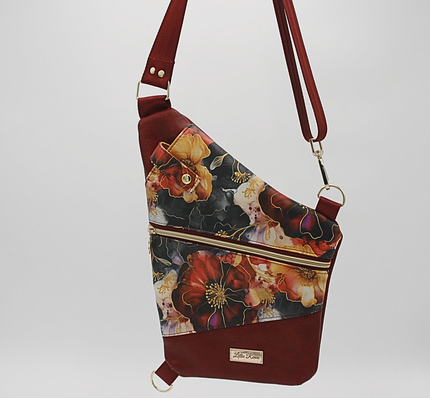 ✔ Luxurious red and gold floral print – A timeless, eye-catching design that adds a touch of sophistication.
✔ Front zipper pocket – Keep essentials like keys, cash, and small items easily accessible. Adjustable nylon webbing strap – Comfortable and versatile for the perfect fit.