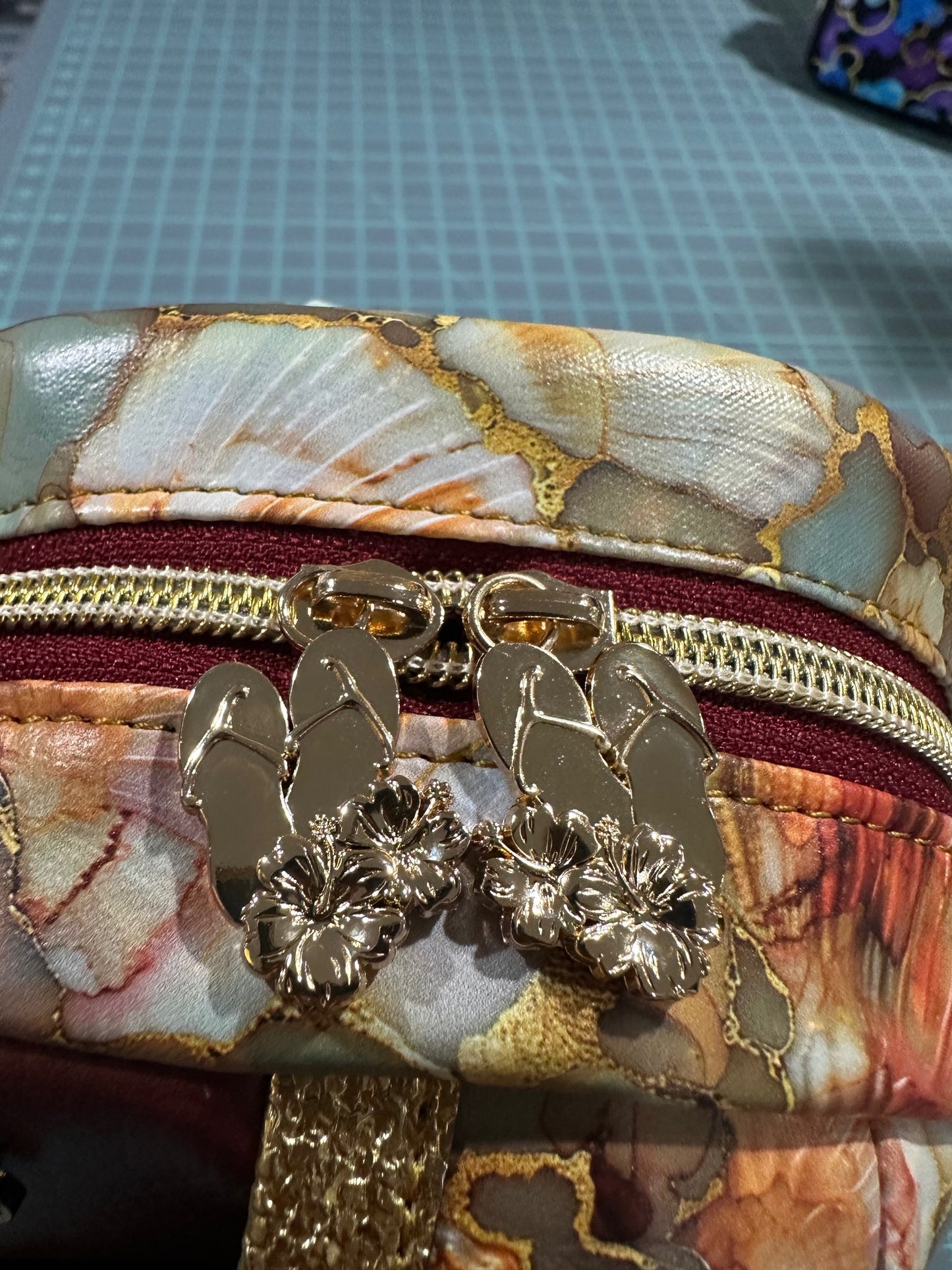 Top zipper closure with dual flip-flop zipper pulls for easy opening from either side.