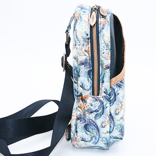 A top double brushed copper zipper pull closure for added security on the blue paisley sling