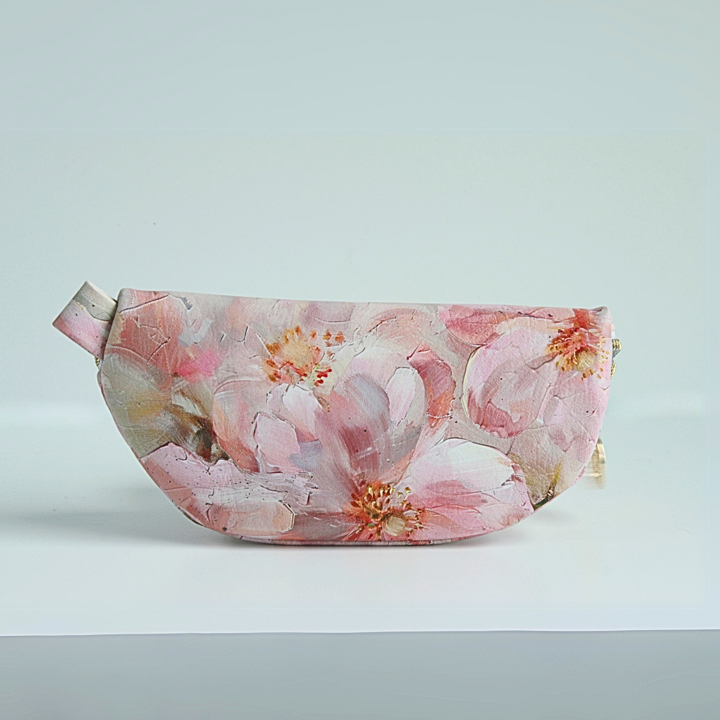 the back oft the Handmade medium pink floral sunglass case with water-resistant canvas interior and gold zipper hardware from the Passionate Pink Collection.