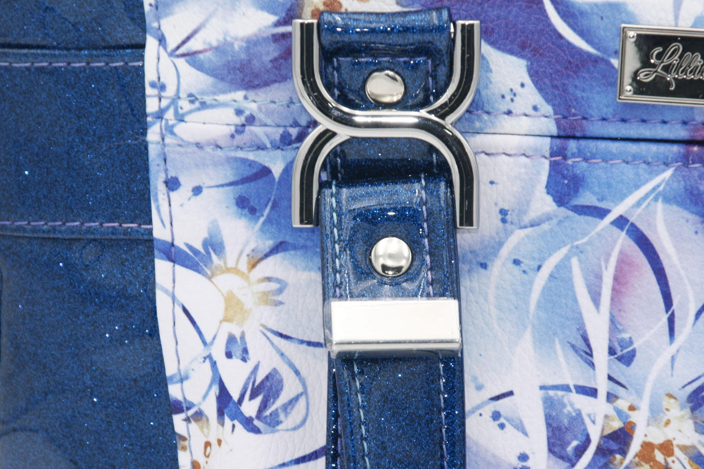 The unique silver hardware infinity connector for the grab handles which are glitter vinyl