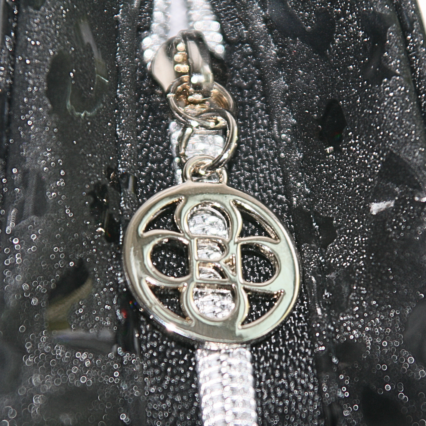 special unique silver hardware includes zipper pulls
