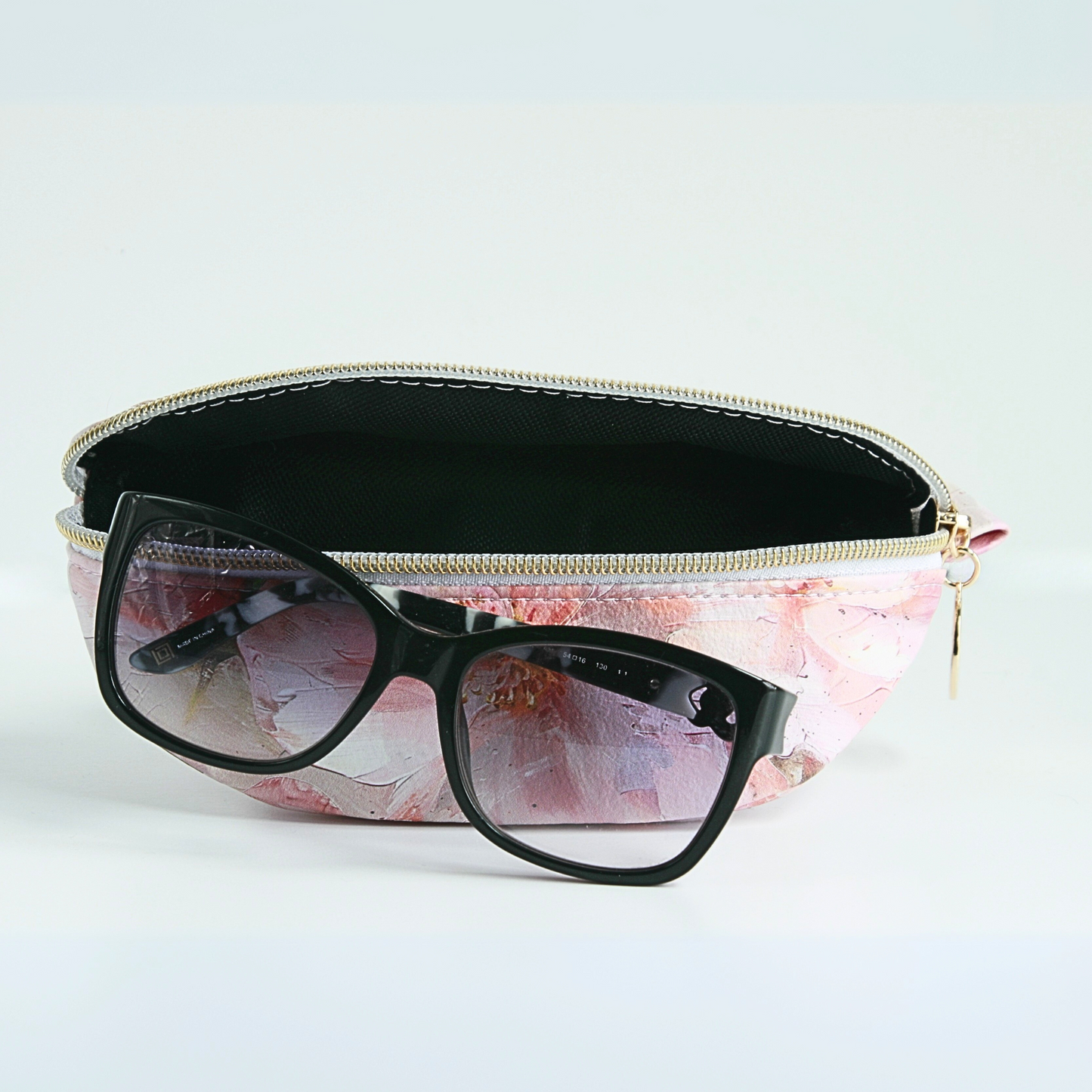 Handmade medium pink floral sunglass case with water-resistant canvas interior and gold zipper hardware from the Passionate Pink Collection.