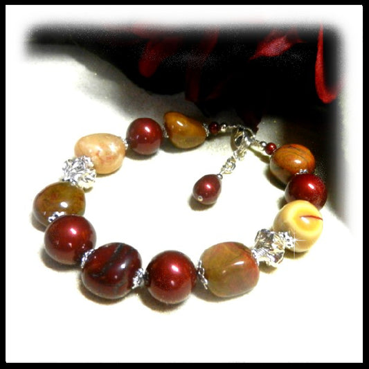 Handmade Mookaite gemstone bracelet with burgundy and mustard stones, sterling silver beads, clasp, and extender chain. Natural earth-tone artisan jewelry.