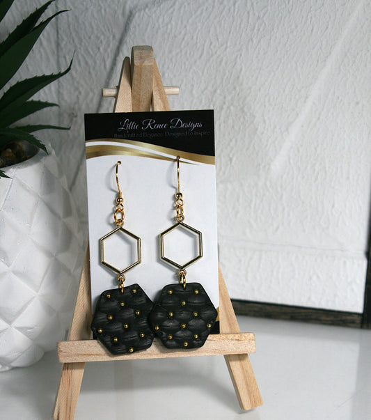 Black quilted texture polymer clay earrings with gold beads and gold connecter.  3" in length