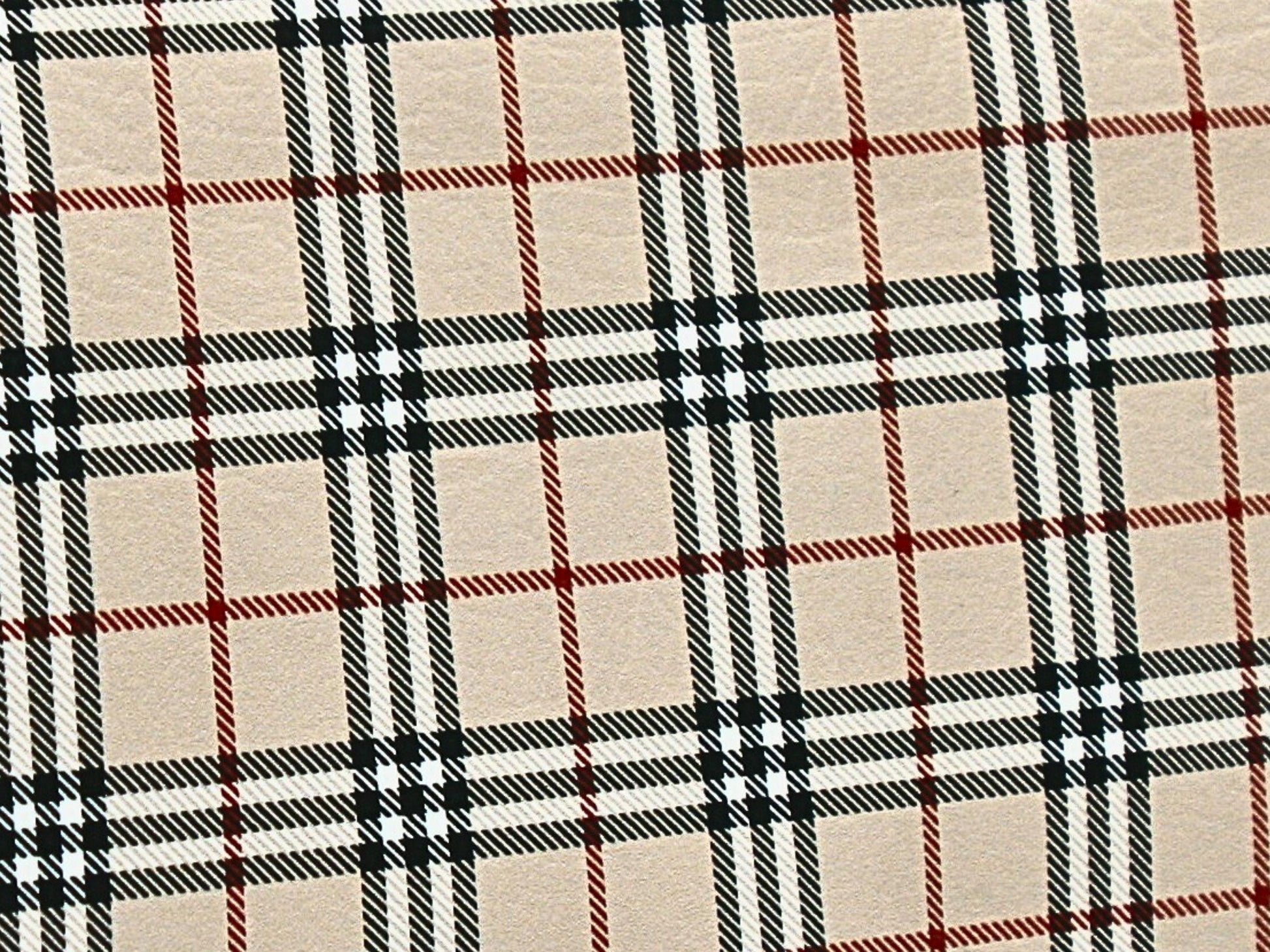 The red, black and tan tartan vinyl has a slight texture like leather as you can see in this close up.