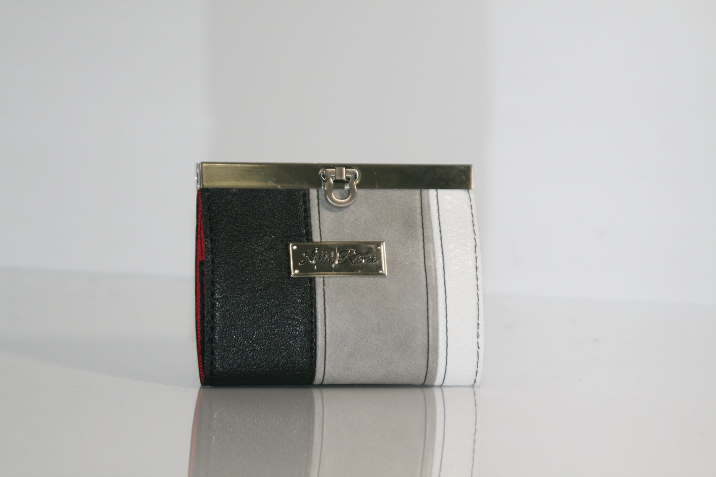 Frosted Obsidian accordion wallet in white, gray, and black faux leather

