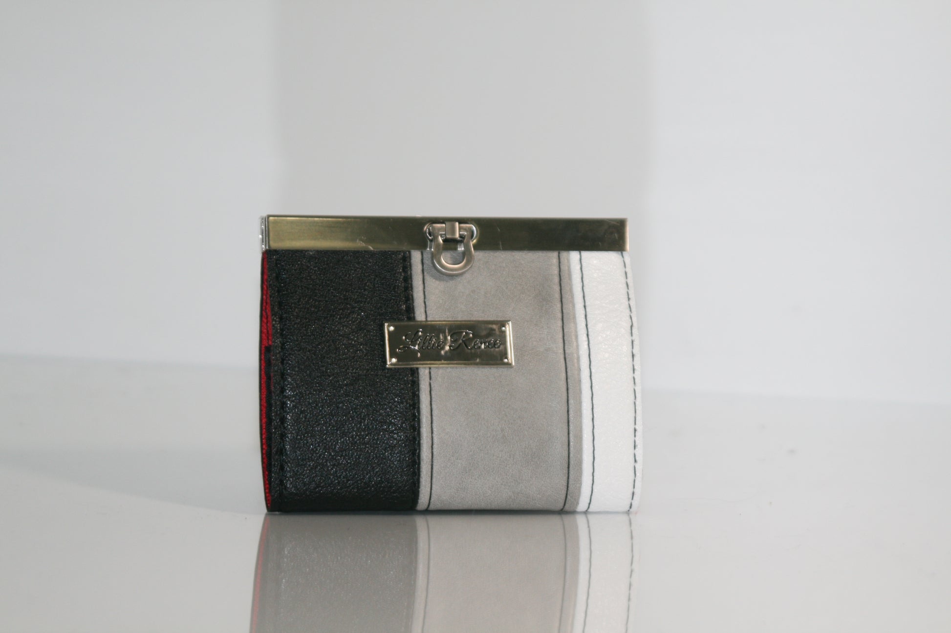 Frosted Obsidian accordion wallet in white, gray, and black faux leather


