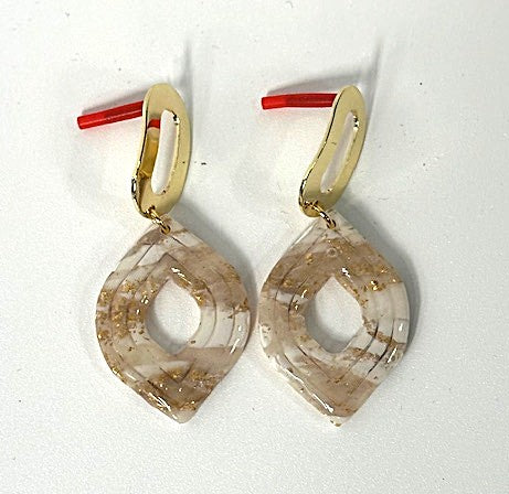 Pair of earrings with geometric design on a white background