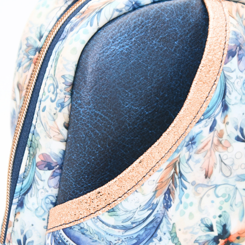 A front slip pocket for easy-access essentials in the blue paisley sling