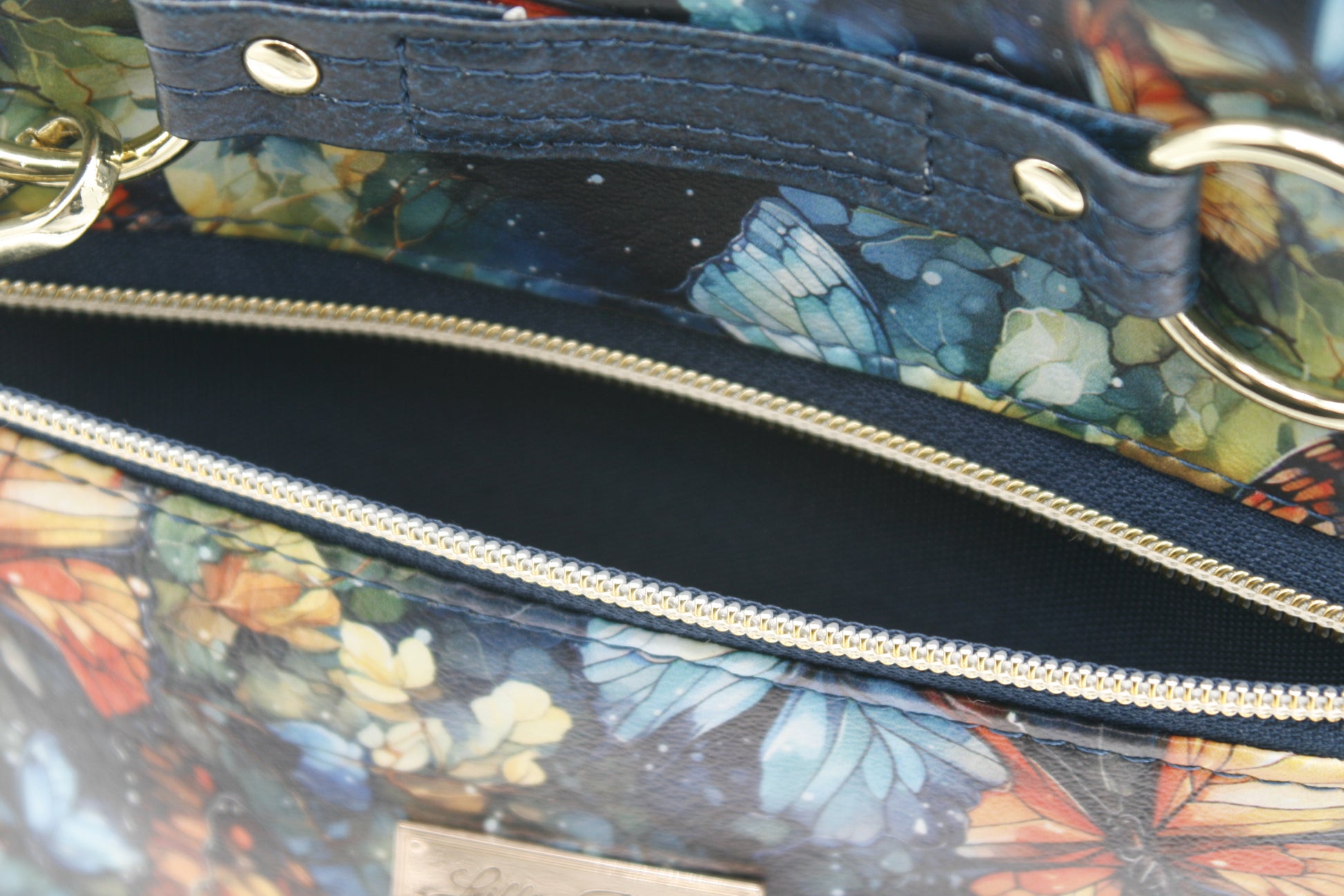 Front zipper pocket with tassel accent – Stylish and functional for quick access to essentials.