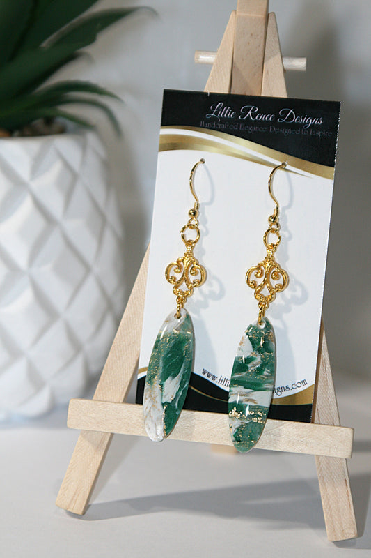 green and white polymer clay oval earrings with gold swirl connector