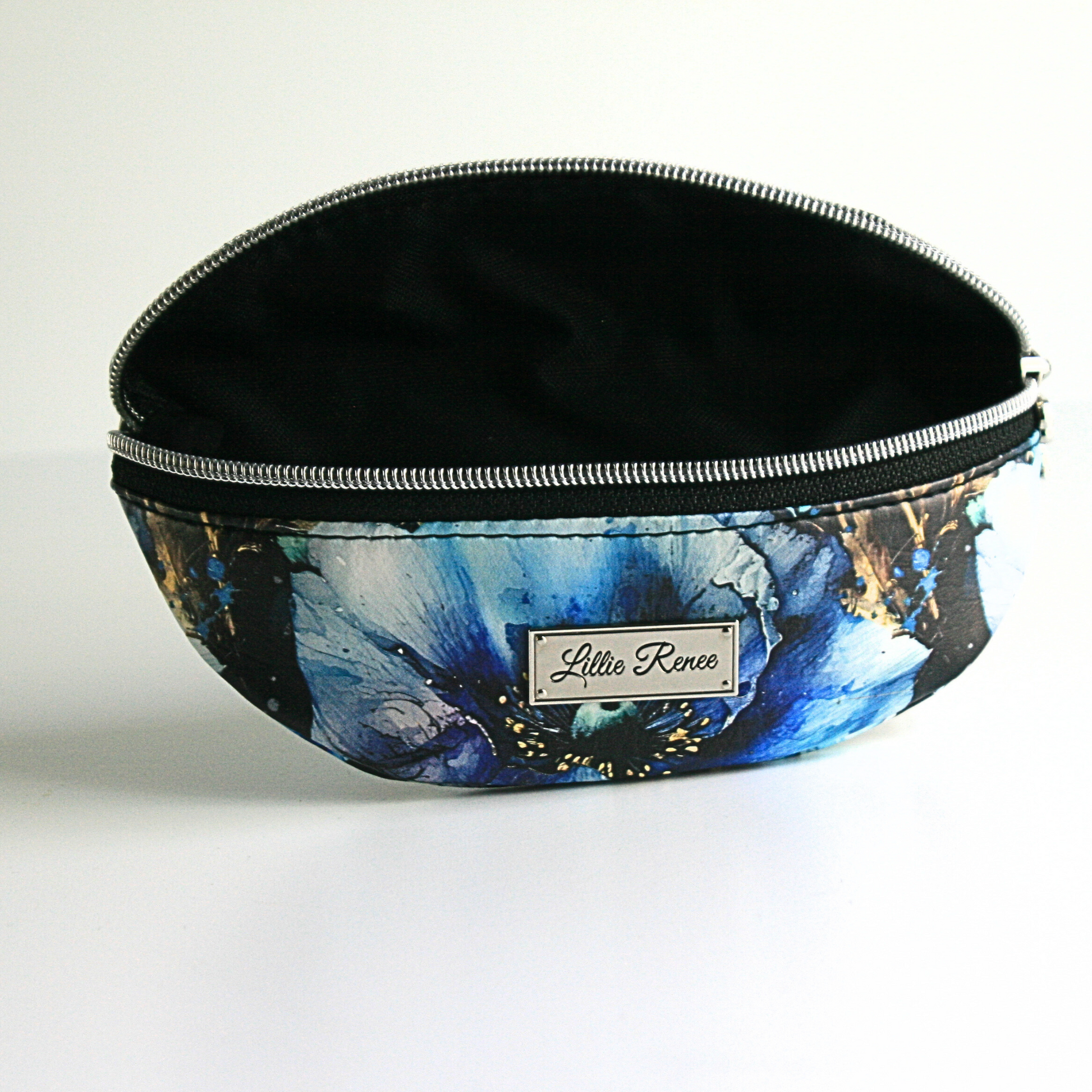inside the blue poppies glasses case is a Black interior water resistant canvas