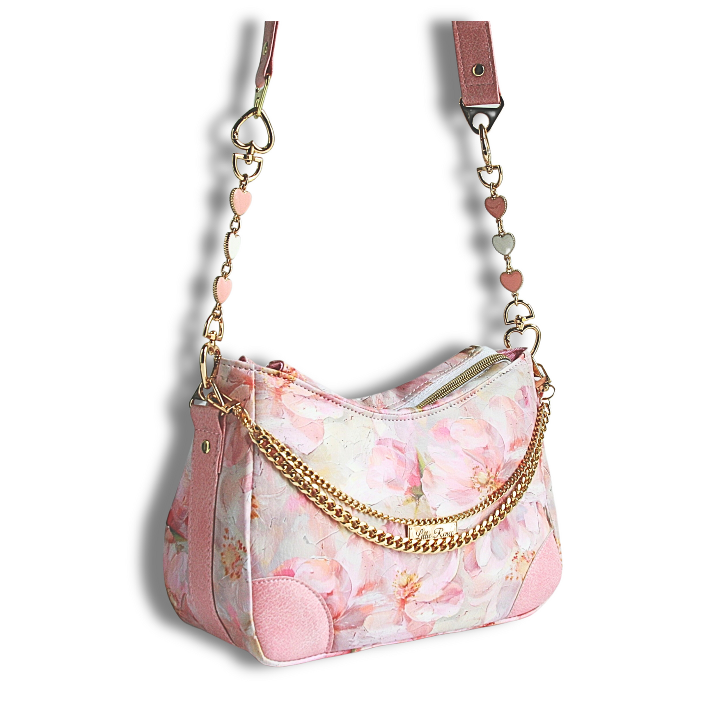 Pink floral vinyl shoulder bag with gold 
 heart extender chain and a front decorative chain with zipper closure