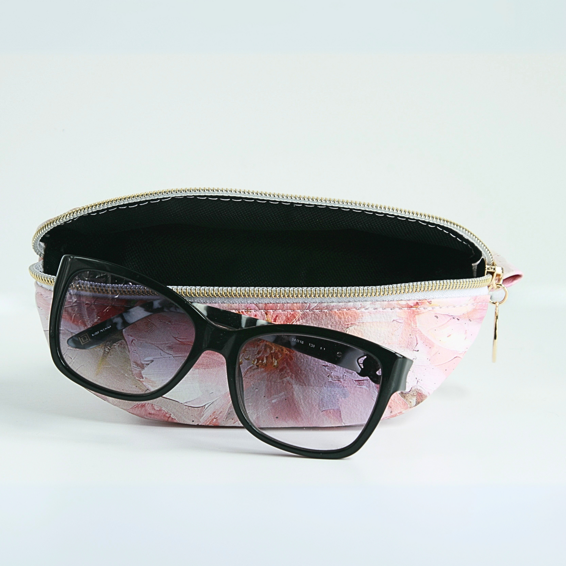 Handmade medium pink floral sunglass case with water-resistant canvas interior and gold zipper hardware from the Passionate Pink Collection.